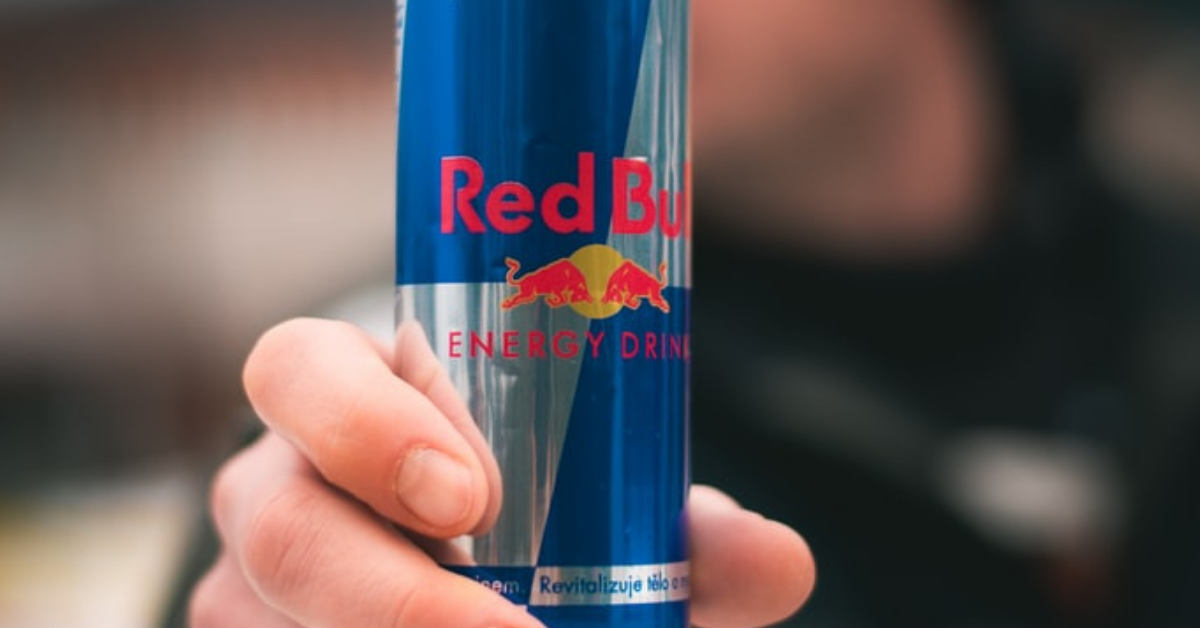 periodontal patient holds can of red bull and learns about the affects of energy drinks on your teeth and gums