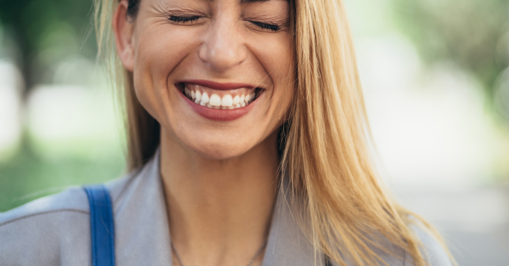 woman smiles wearing her tooth splint